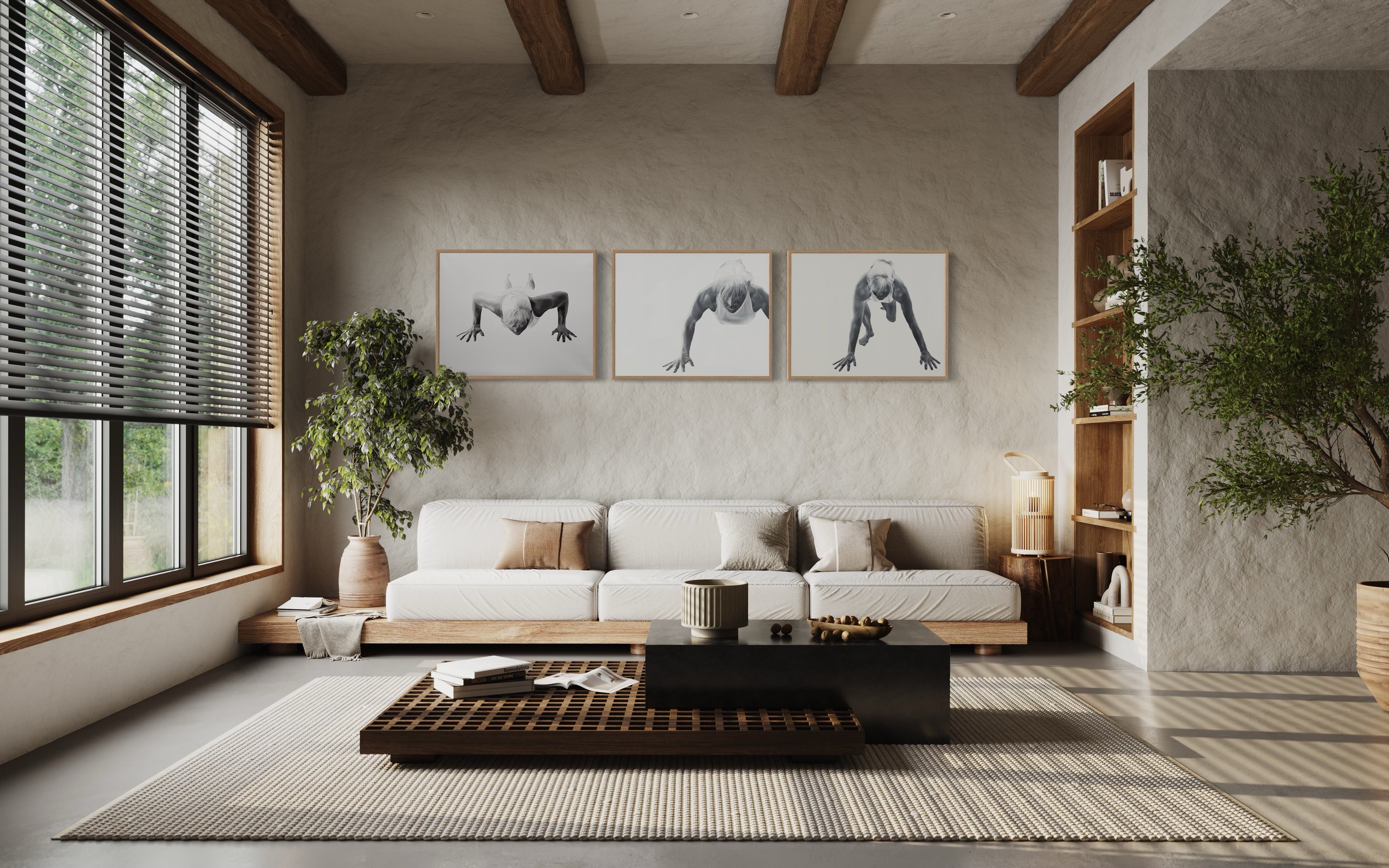 Living room in minimalistic interior with prints of Jenny Mørk´s paintings titled "Get up again" on the wall with oak frames.